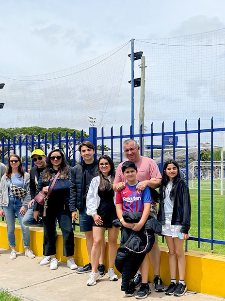 Tourists posing for photos near La Bombonera stadium in Buenos Aires.