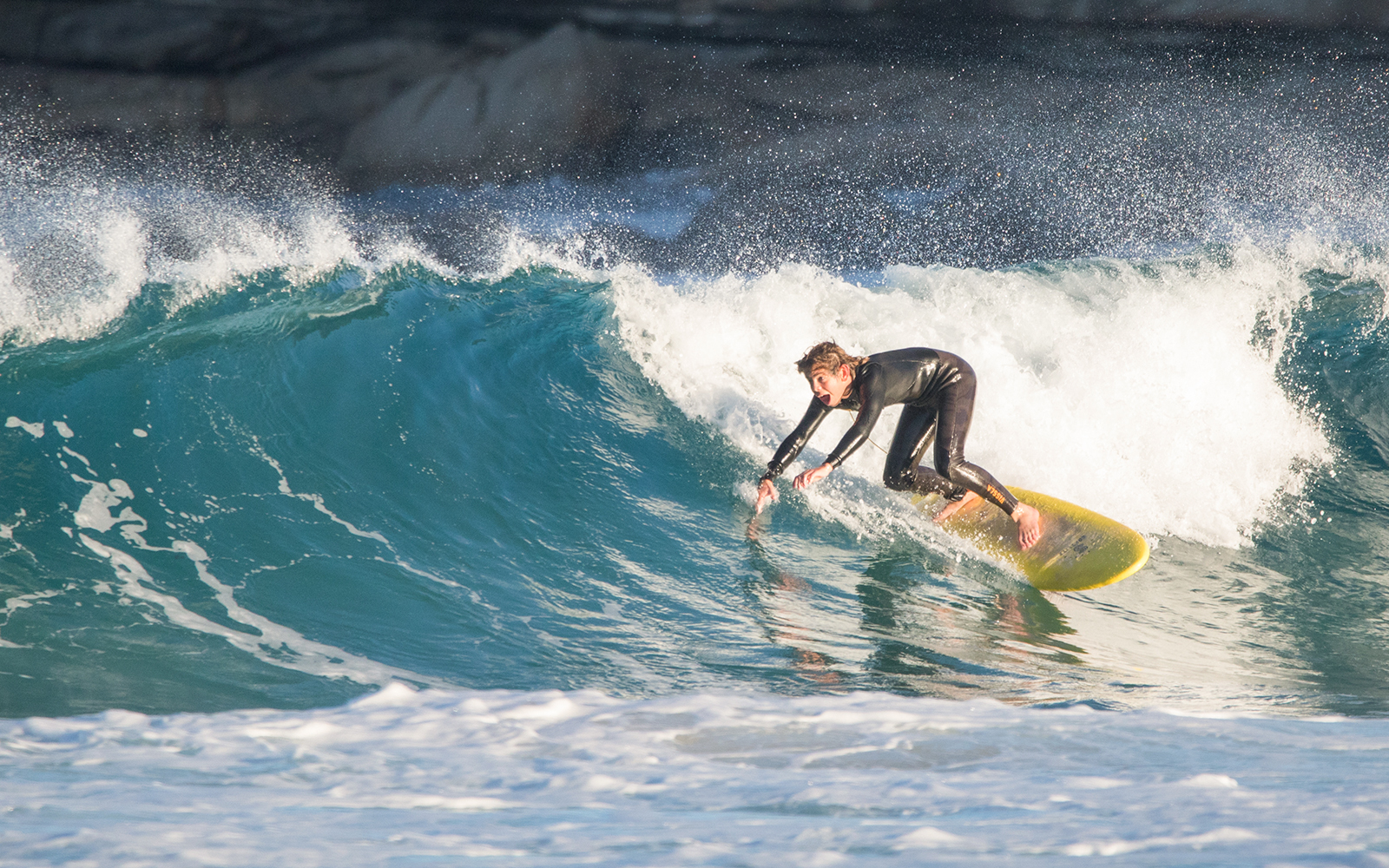 Huge gush of water overtaking a man while surfing