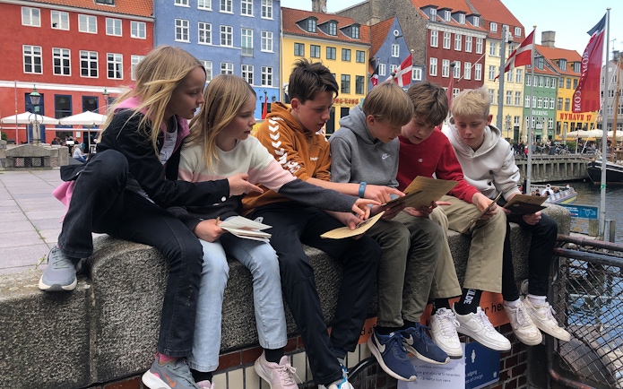 Children solving clues during Nyhavn Mystery Adventure in Copenhagen.