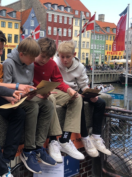 Children solving clues during Nyhavn Mystery Adventure in Copenhagen.