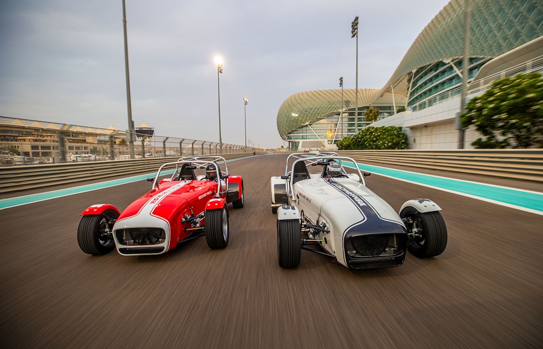 Caterham Seven 360 cars racing at Yas Marina Circuit in Abu Dhabi.