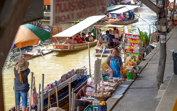 Boats with goods at Damnoen Saduak Floating Market, Bangkok tour.
