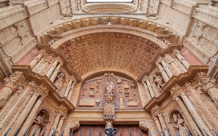 Mallorca Cathedral ornate entrance with detailed carvings and columns.