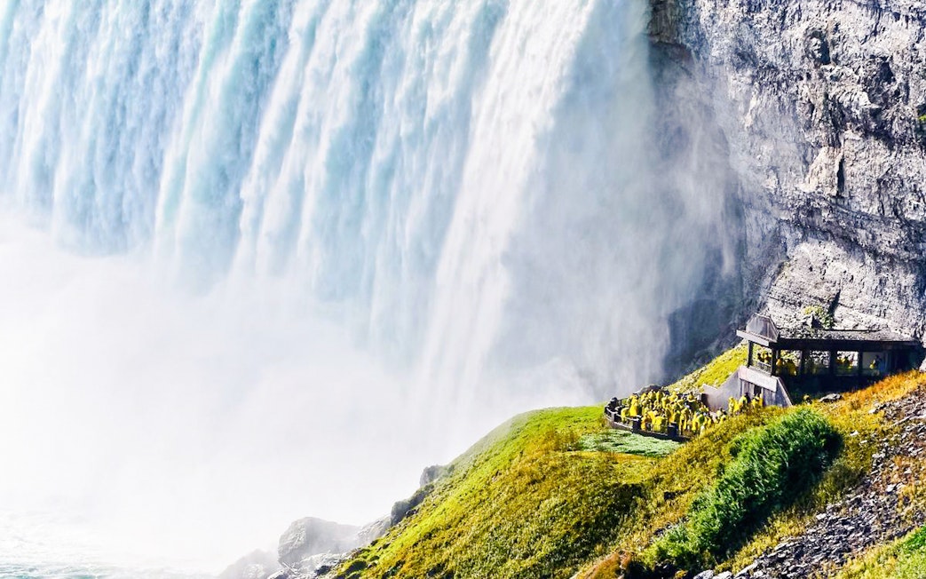 Horseshoe Falls at Niagara with visitors at Journey Behind the Falls, Canada.