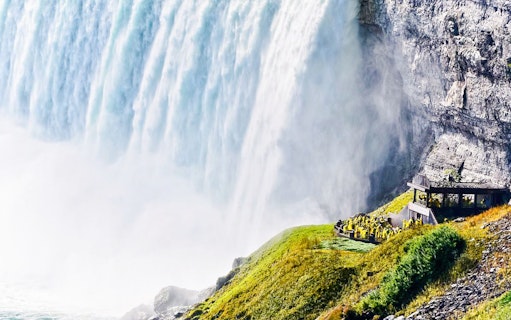 Horseshoe Falls at Niagara with visitors at Journey Behind the Falls, Canada.