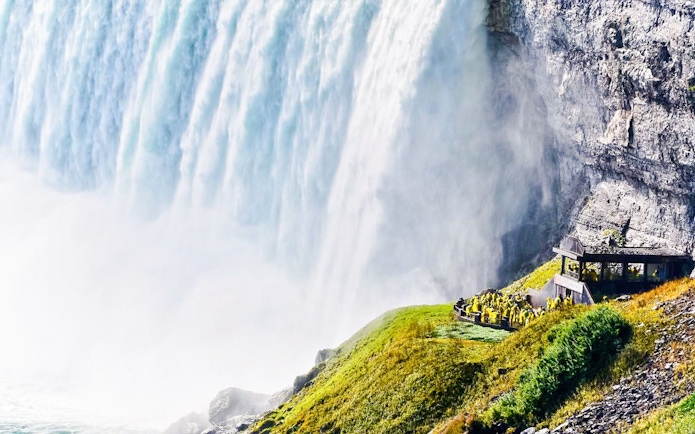 Horseshoe Falls at Niagara with visitors at Journey Behind the Falls, Canada.