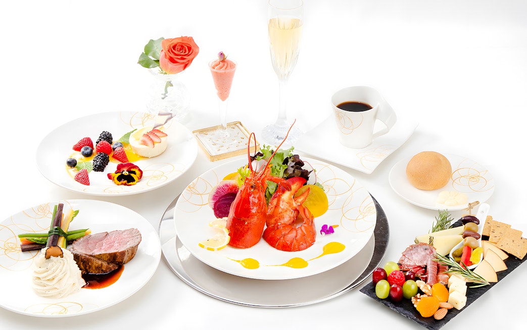 Seafood platter with lobster, assorted fruits, and gourmet dishes on Nova Five Star 2.