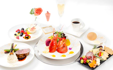 Seafood platter with lobster, assorted fruits, and gourmet dishes on Nova Five Star 2.