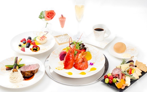 Seafood platter with lobster, assorted fruits, and gourmet dishes on Nova Five Star 2.