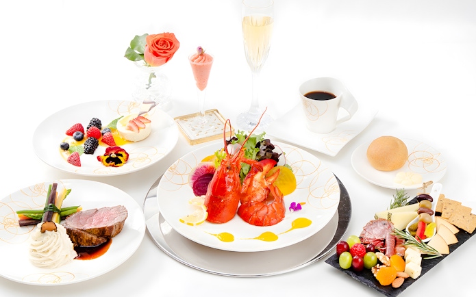 Seafood platter with lobster, assorted fruits, and gourmet dishes on Nova Five Star 2.