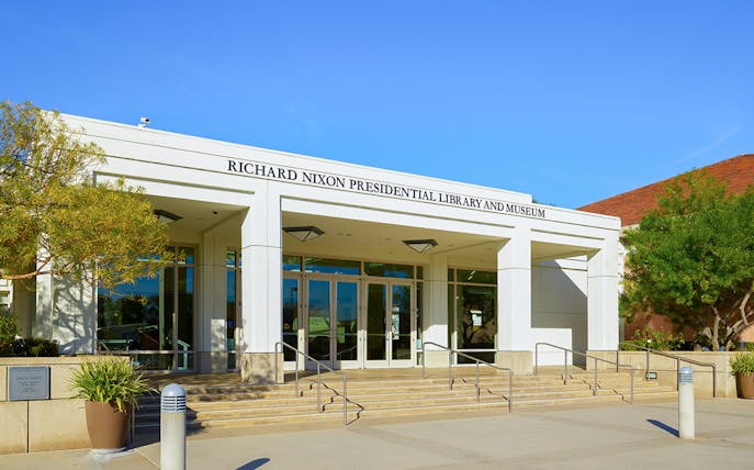 Richard Nixon Presidential Library entrance with steps and greenery.