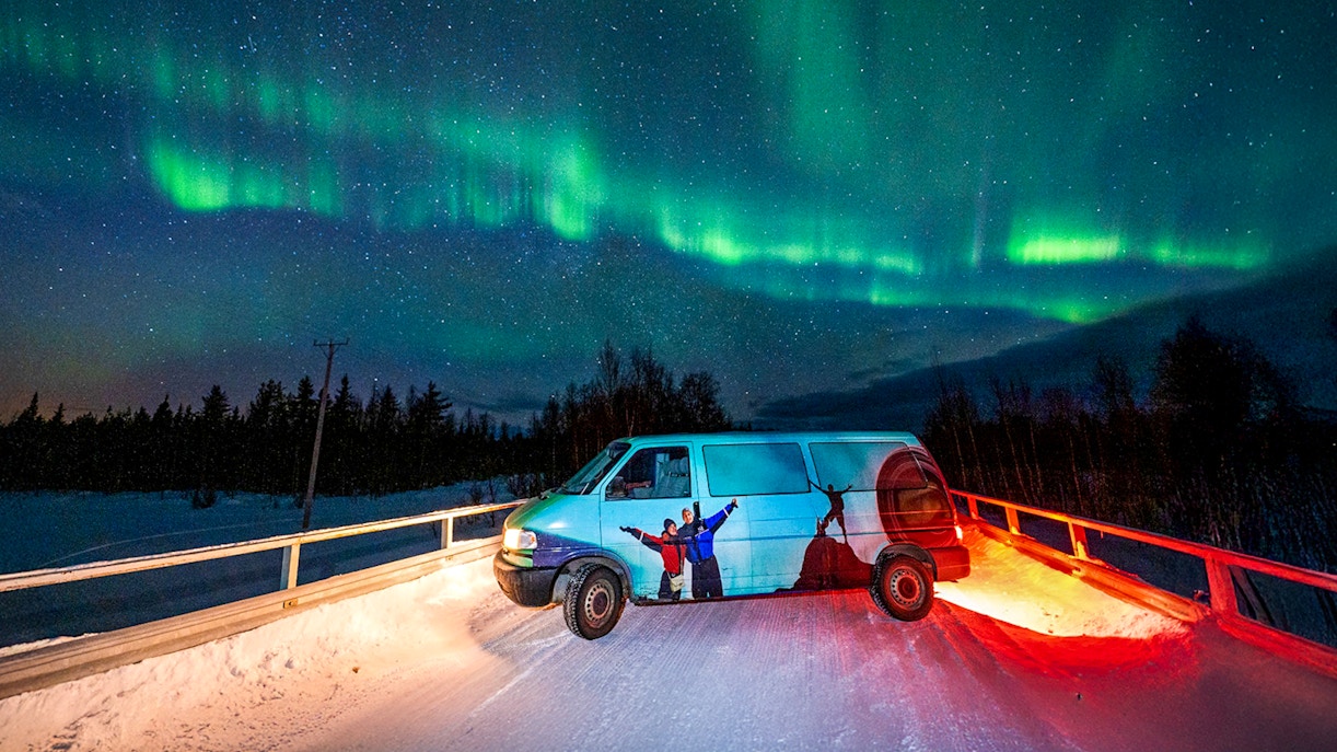Van parked under Northern Lights during Northern Lights Camp Visit