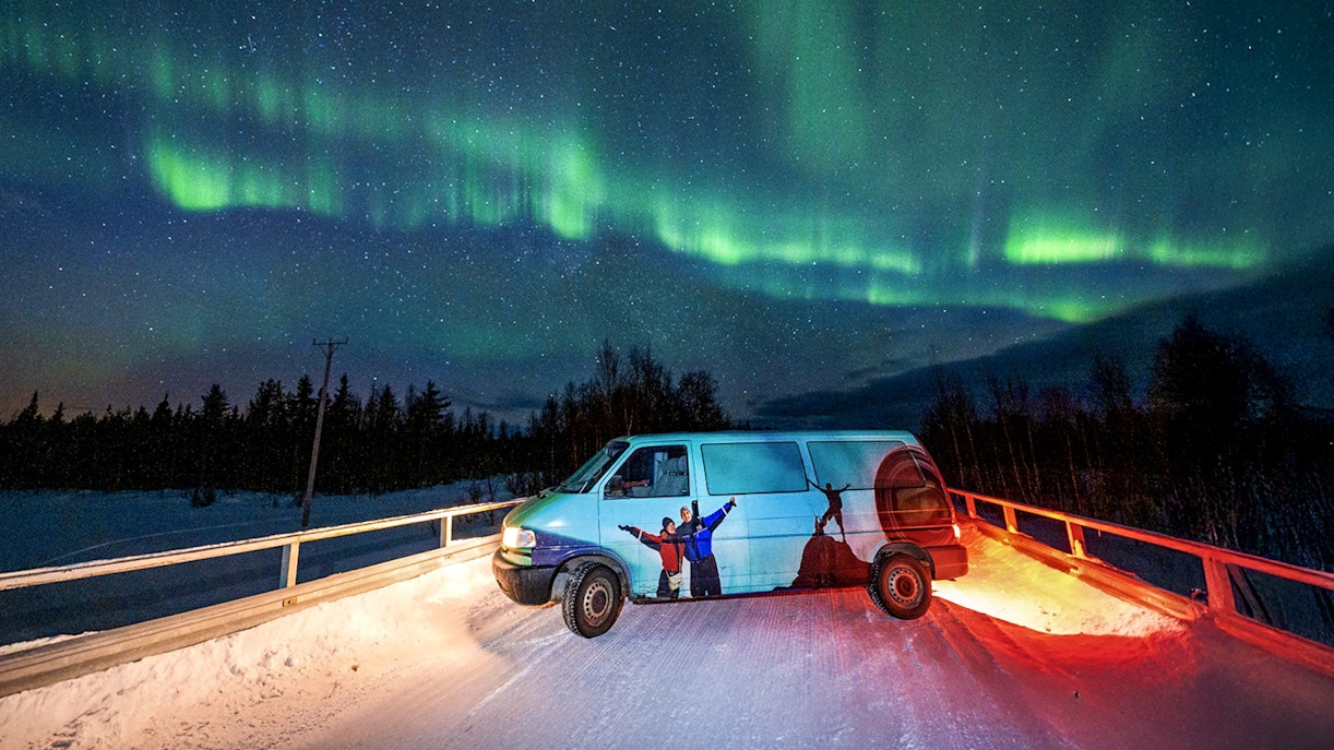 Van parked under Northern Lights during Northern Lights Camp Visit