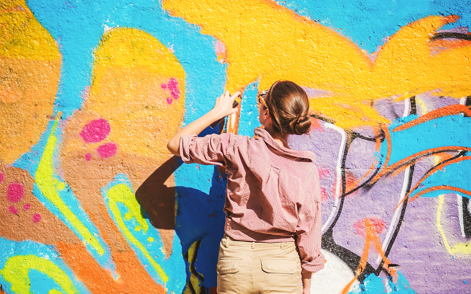 Colorful street art mural in Paris featuring vibrant abstract designs.