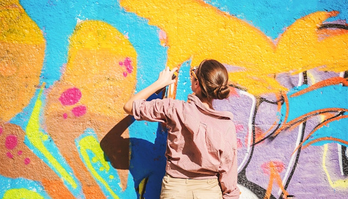 Colorful street art mural in Paris featuring vibrant abstract designs.