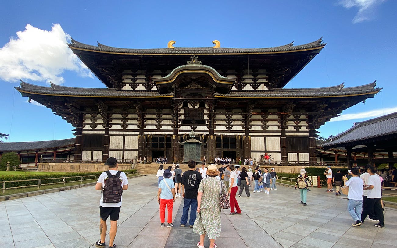 Tourists photographing Todai-ji Temple in Nara, Kyoto.