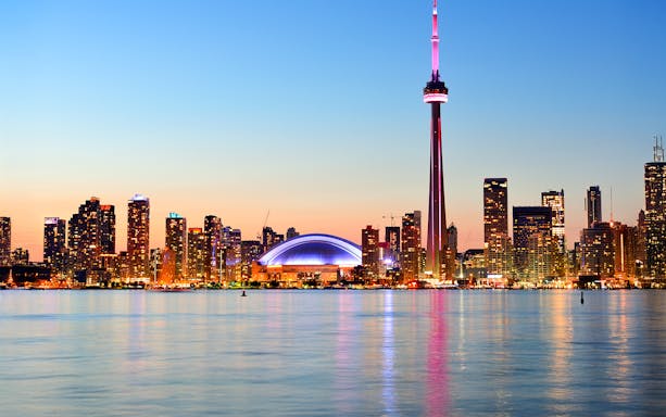 Toronto skyline with CN Tower and waterfront view.