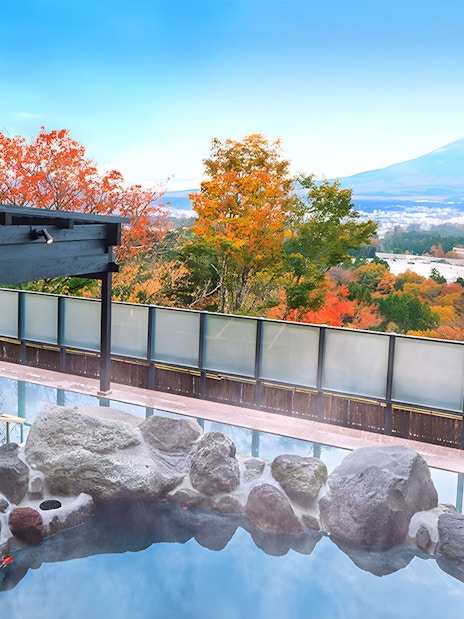 Konohananoyu hot springs with view of Mt. Fuji and autumn foliage.