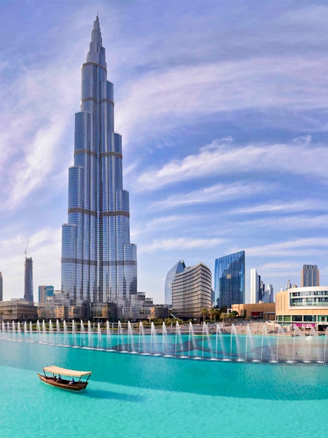 Burj Khalifa with Dubai Fountain and city skyline in the background.