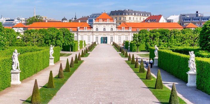 Lower Belvedere palace gardens with statues and hedges in Vienna.