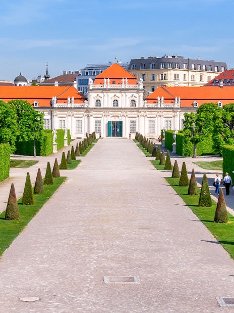 Lower Belvedere palace gardens with statues and hedges in Vienna.