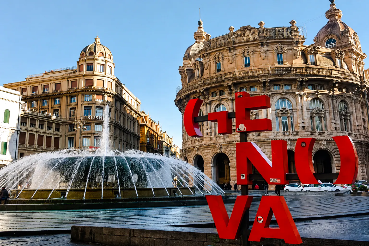 Fountain and historic buildings in Piazza De Ferrari, Genoa.