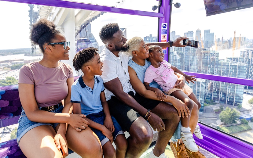 Family enjoying a ride on the IFS Cloud Cable Car in London.