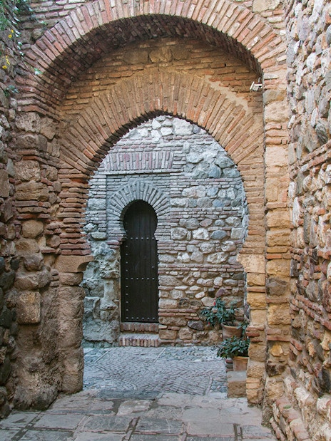 Stone archway in Alcazaba Castle, Málaga, on Roman Theater walking tour.