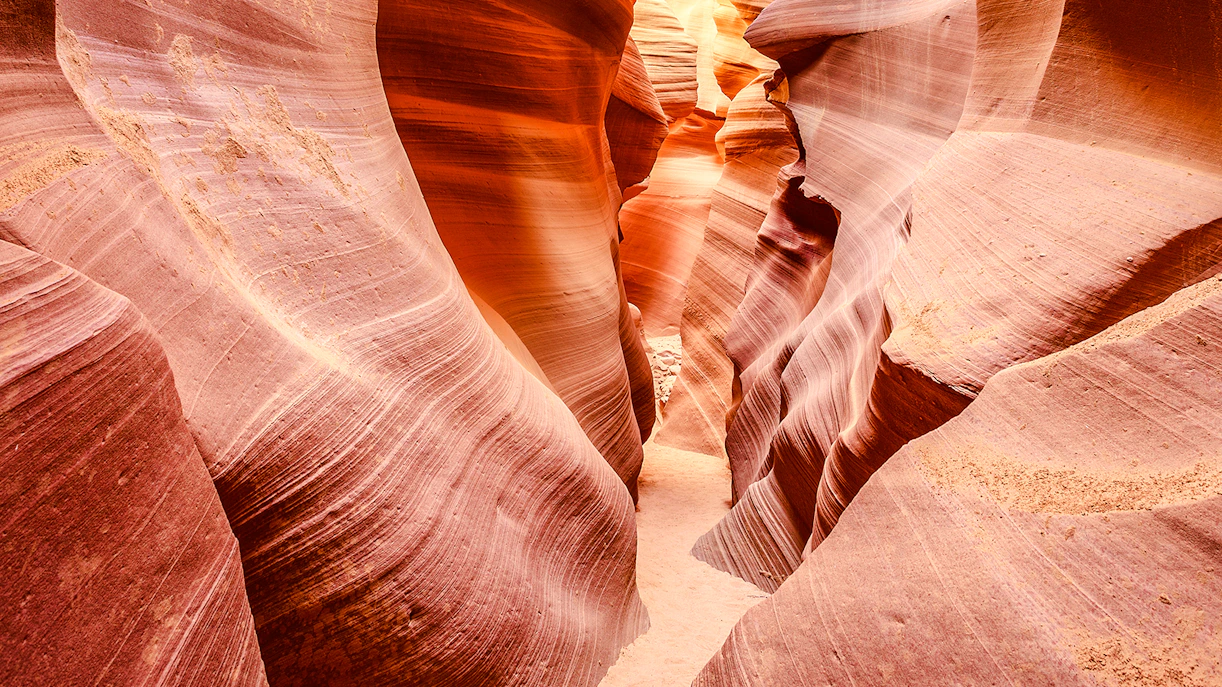Lower Antelope Canyon's narrow sandstone passage with smooth, curved walls.