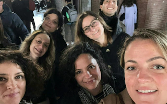 Group of people enjoying Bologna city exploration game.