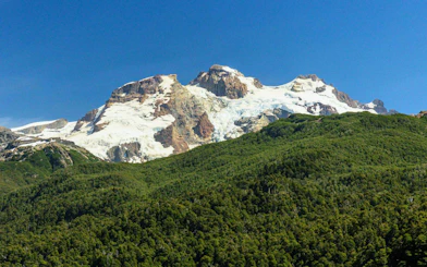 Snow-capped peaks above forests in Nahuel Huapi National Park.