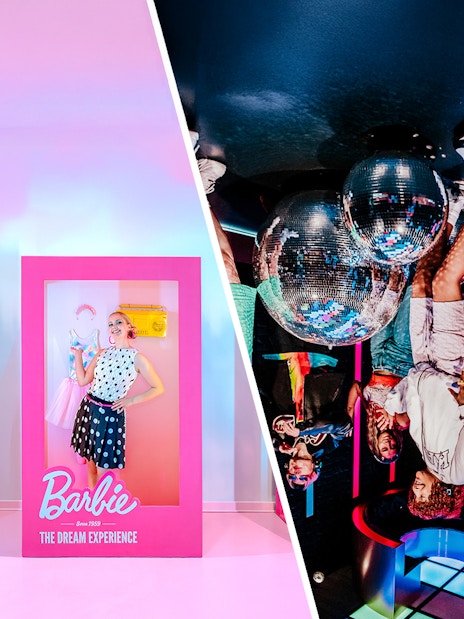 Guests posing inside Barbie-themed boxes at The Dream Experience exhibit.