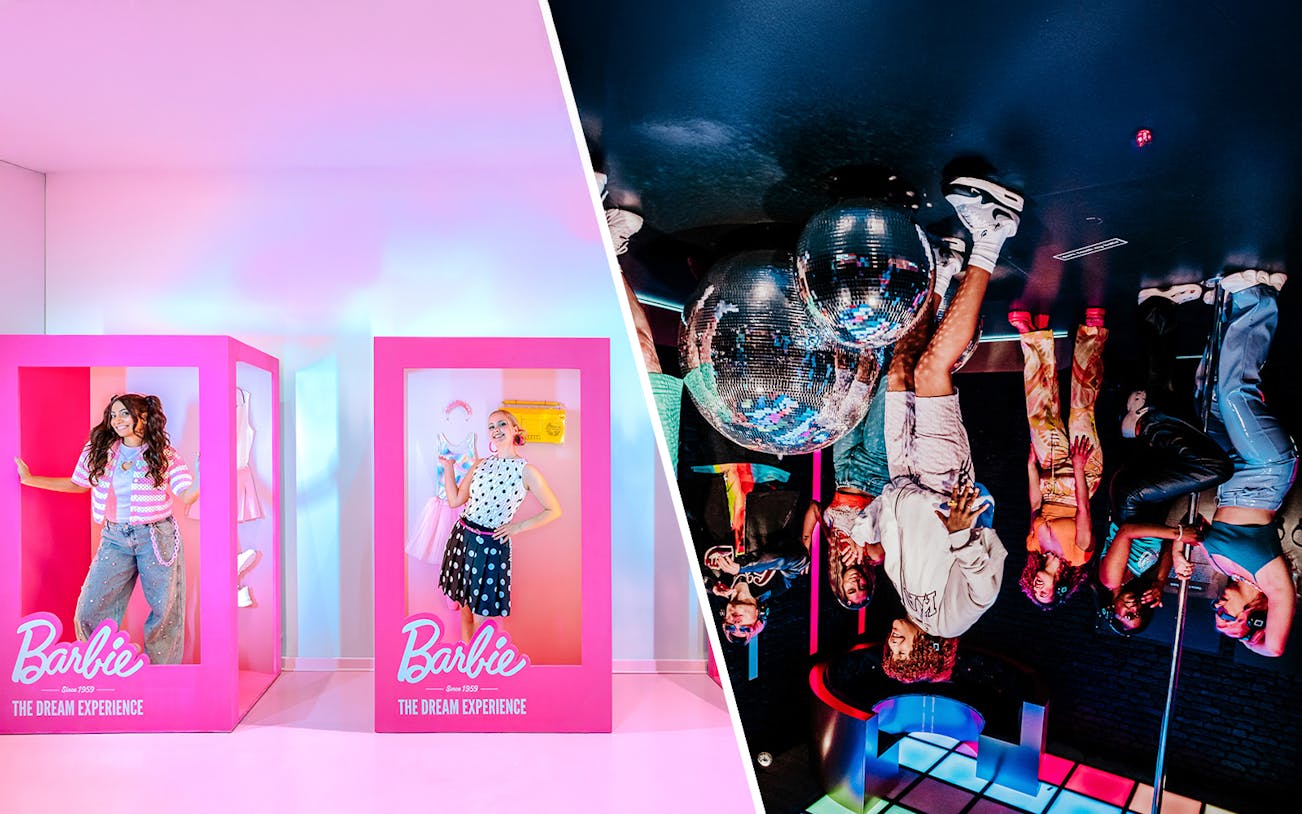 Guests posing inside Barbie-themed boxes at The Dream Experience exhibit.