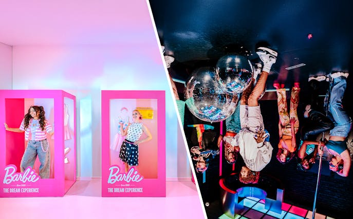 Guests posing inside Barbie-themed boxes at The Dream Experience exhibit.