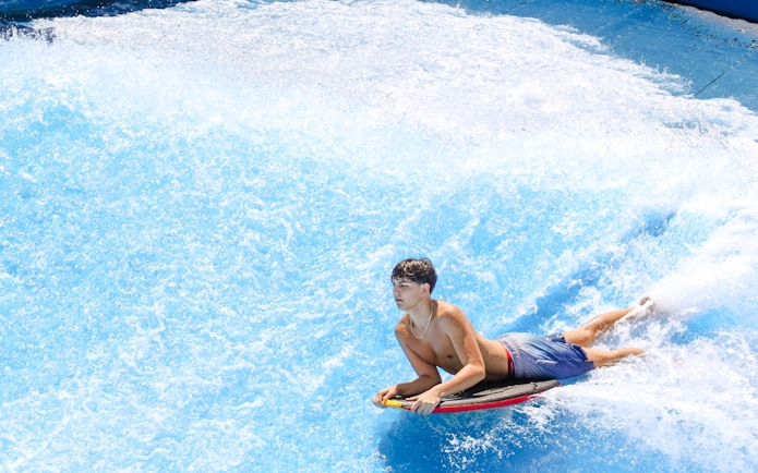 Person surfing on Boogie Bahn ride at Schlitterbahn New Braunfels.