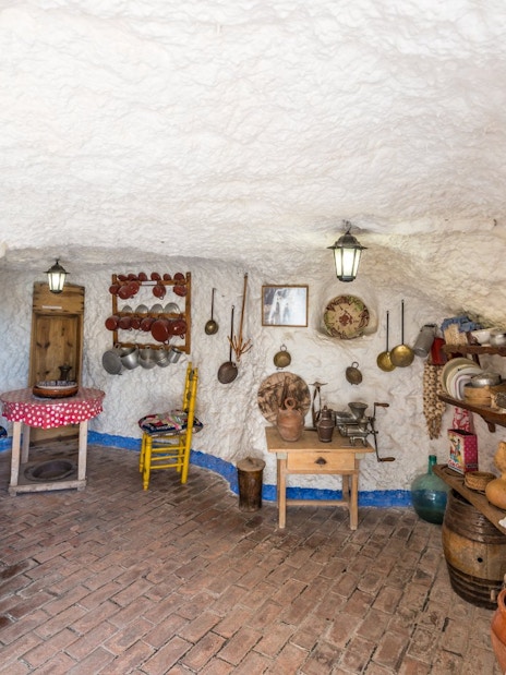 Sacromonte Caves Museum interior with traditional pottery and tools in Granada, Spain.