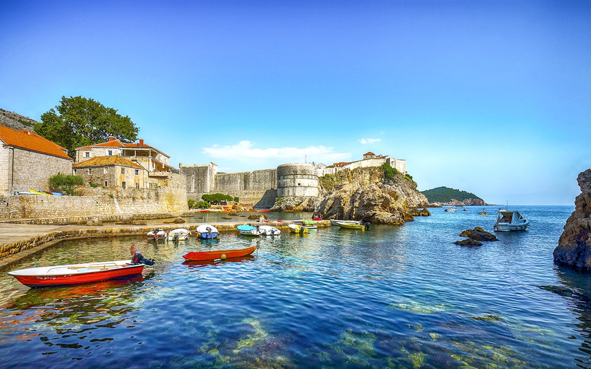 Fort Bokar with boats in the harbor on a sunny day in Dubrovnik, Croatia.