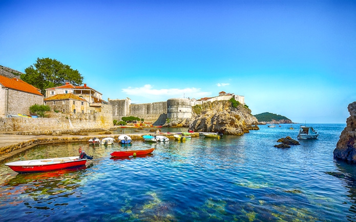 Fort Bokar with boats in the harbor on a sunny day in Dubrovnik, Croatia.