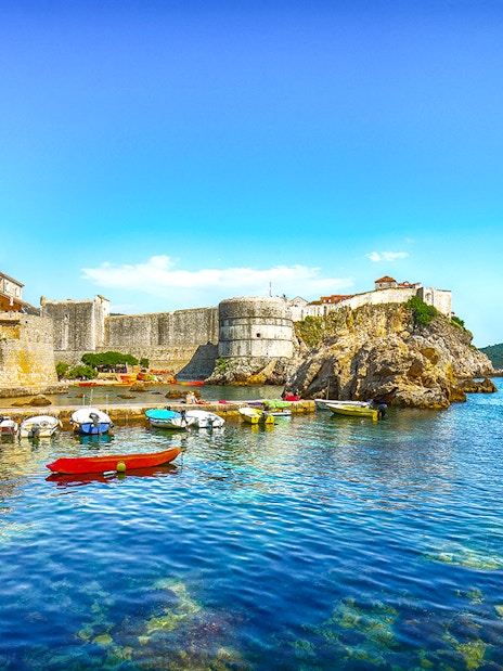 Fort Bokar with boats in the harbor on a sunny day in Dubrovnik, Croatia.