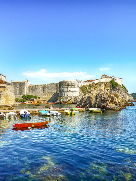 Fort Bokar with boats in the harbor on a sunny day in Dubrovnik, Croatia.