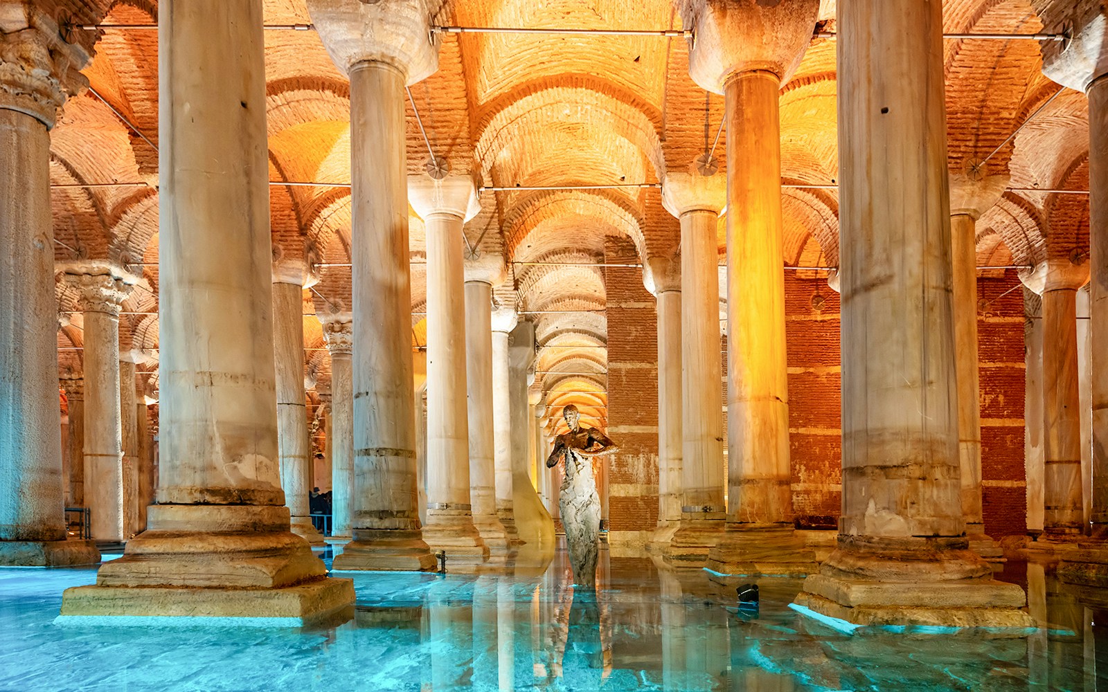 Pillars inside the Basilica Cistern in Istanbul with reflections on the water.