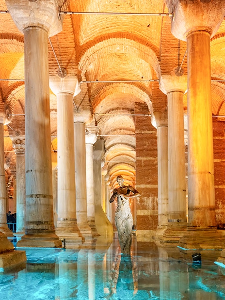 Pillars inside the Basilica Cistern in Istanbul with reflections on the water.