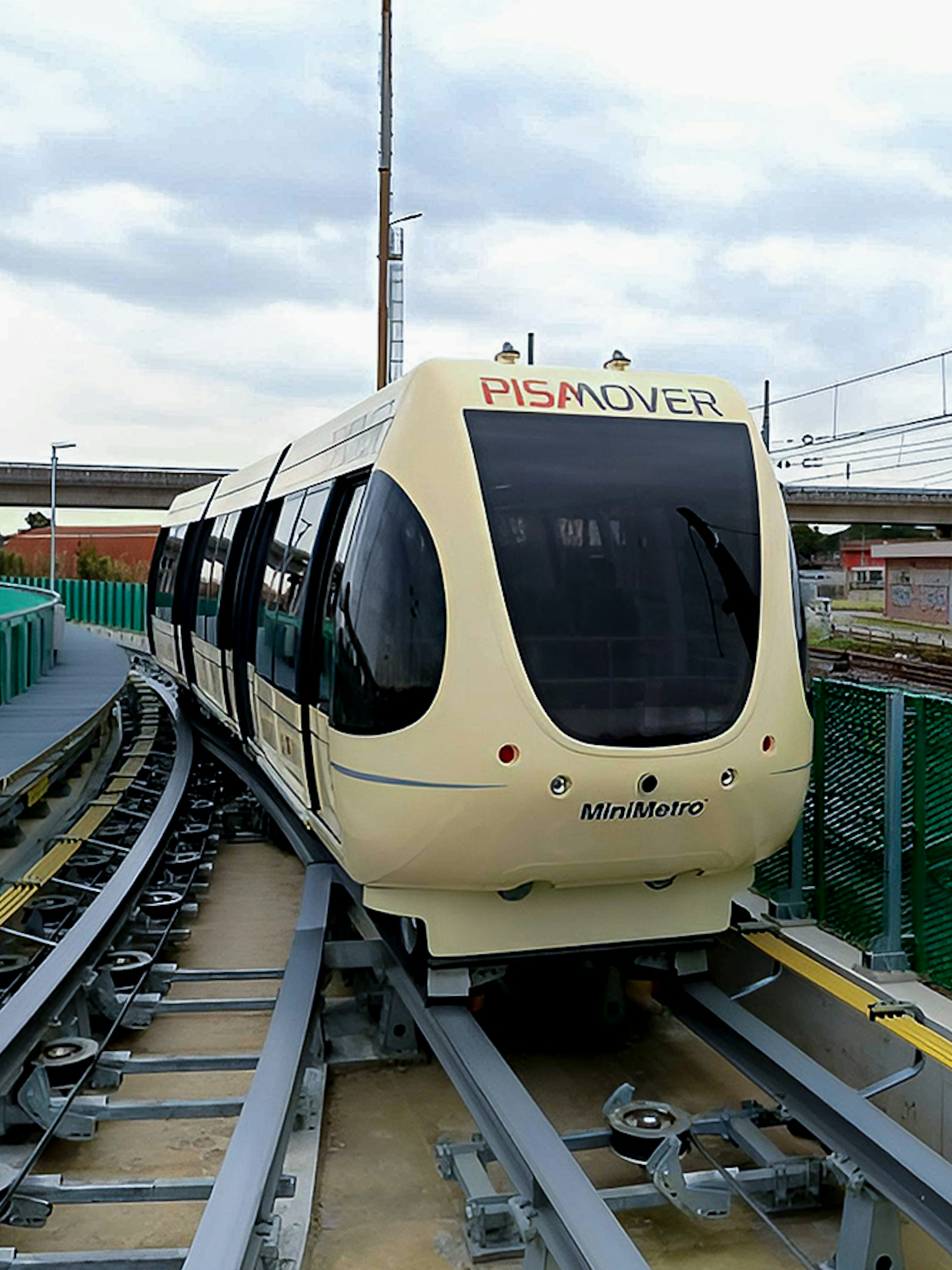 Pisamover Mini Metro on track at Pisa Airport for passenger transfer.