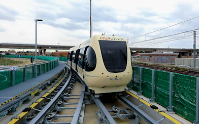 Pisamover Mini Metro on track at Pisa Airport for passenger transfer.