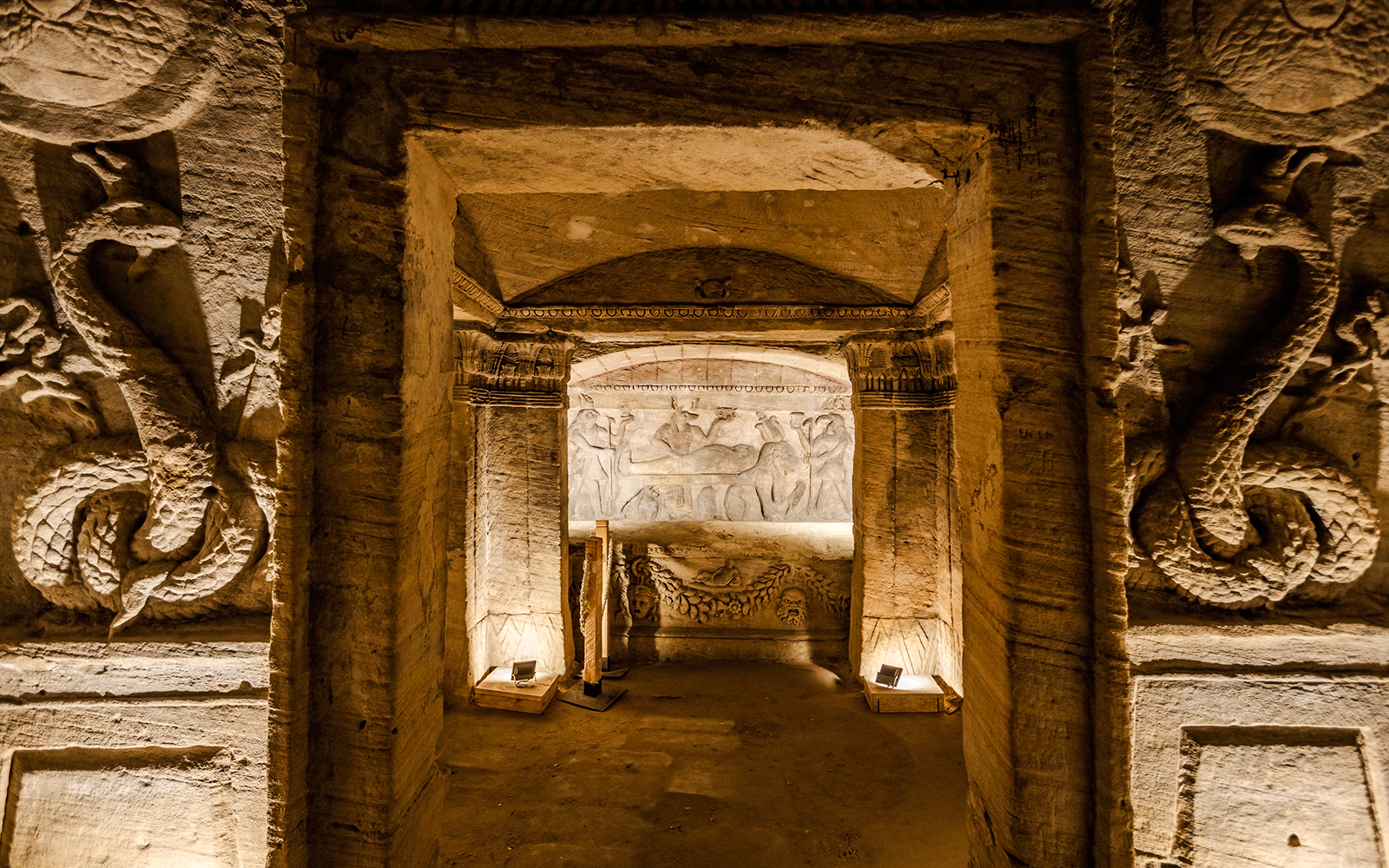 Ancient Egyptian tomb with intricate carvings and hieroglyphs in Cairo.