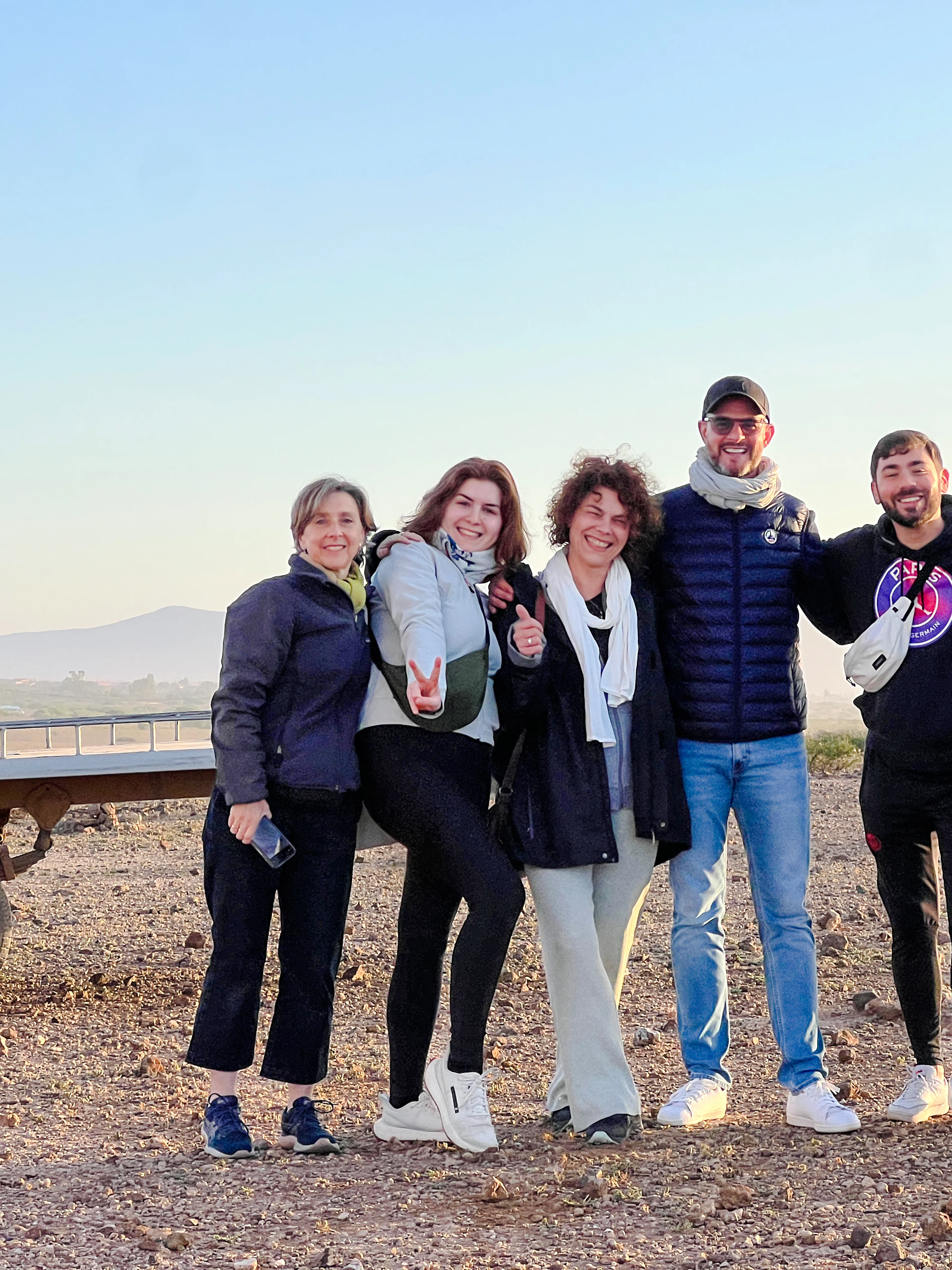 Group enjoying sunrise hot air balloon trip with Atlas Mountains in Marrakesh.