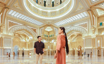 Visitors inside the ornate interior of Qasr Al Watan, Abu Dhabi during a tour from Dubai.