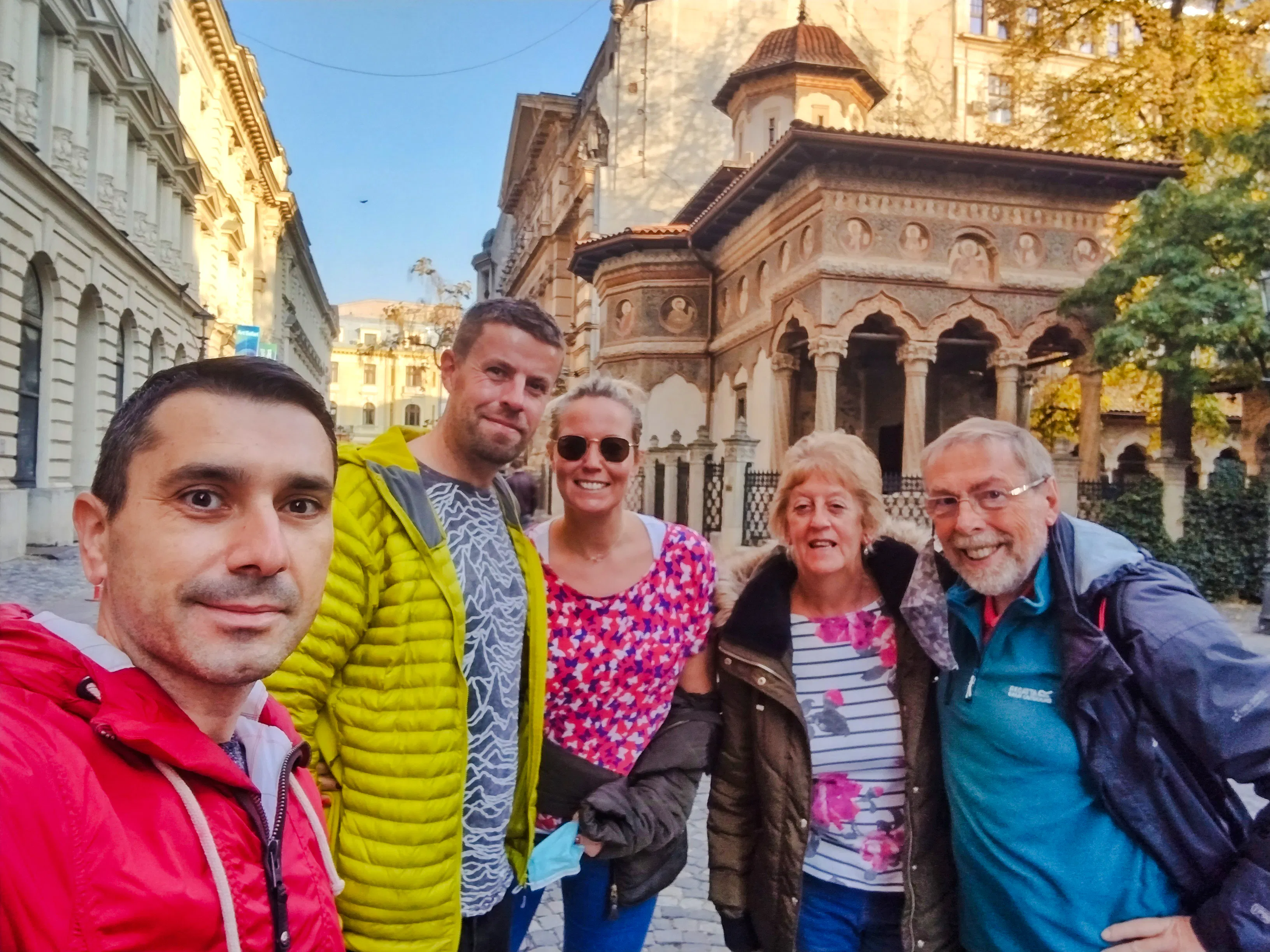 Group of tourists in front of Stavropoleos Monastery during a Bucharest food and culture walking tour.