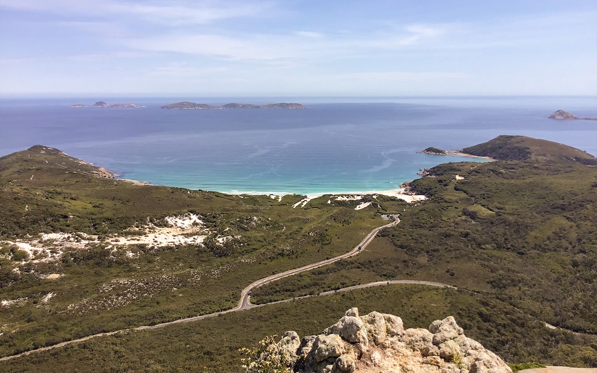 Wilsons Promontory coastline view with winding road and distant islands, Australia.