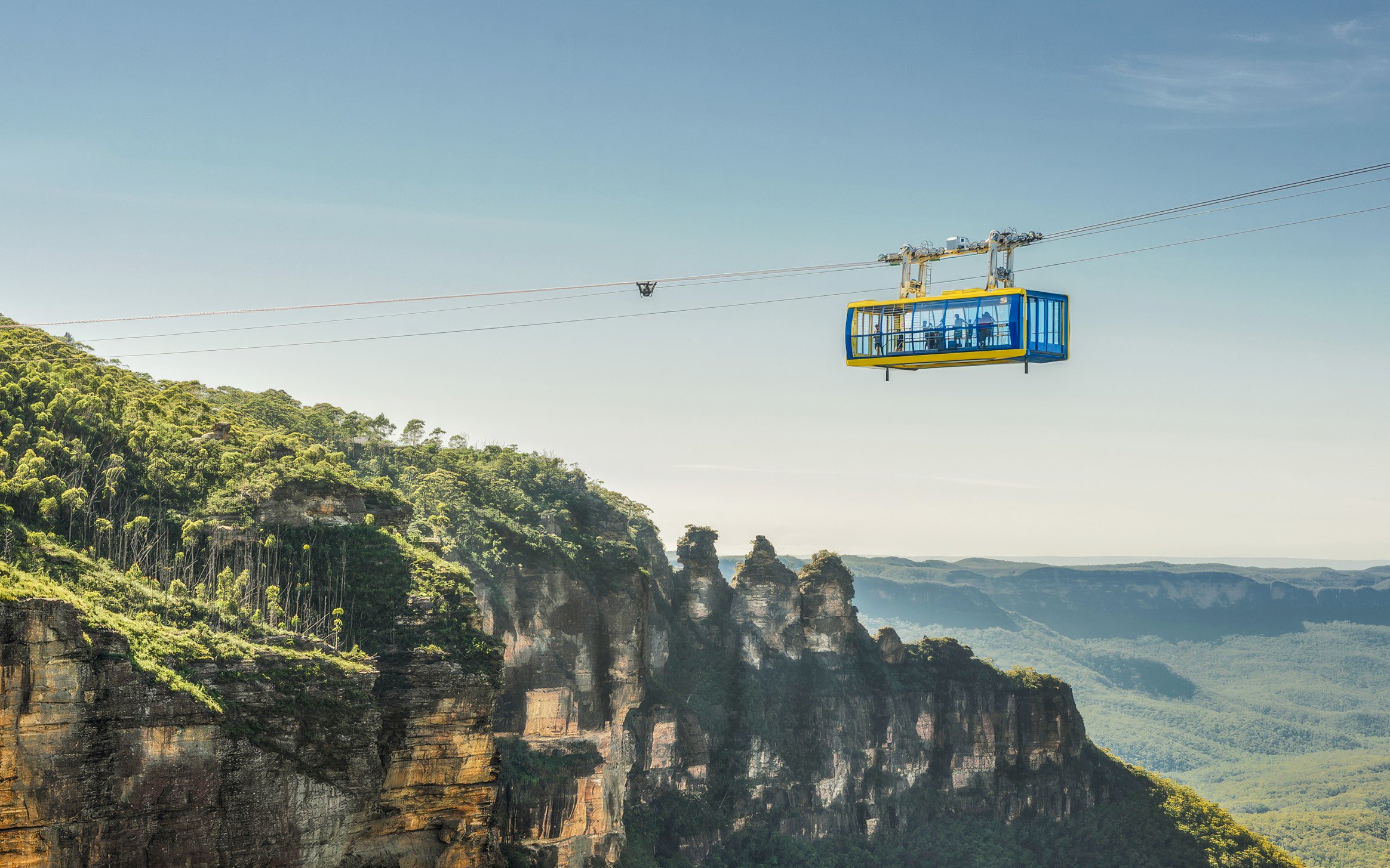 Cable car over Blue Mountains with view of Three Sisters rock formation, Australia.